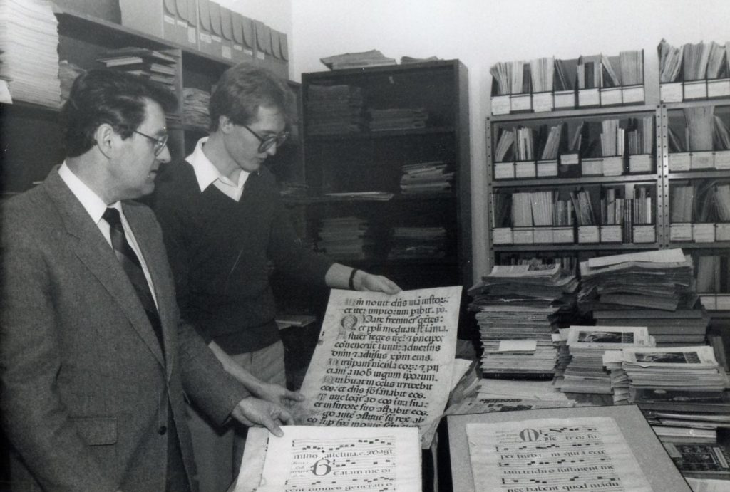 Lawrence Klippenstein (left) and Jim Suderman looking at manuscripts in the Mennonite Heritage Center archives.