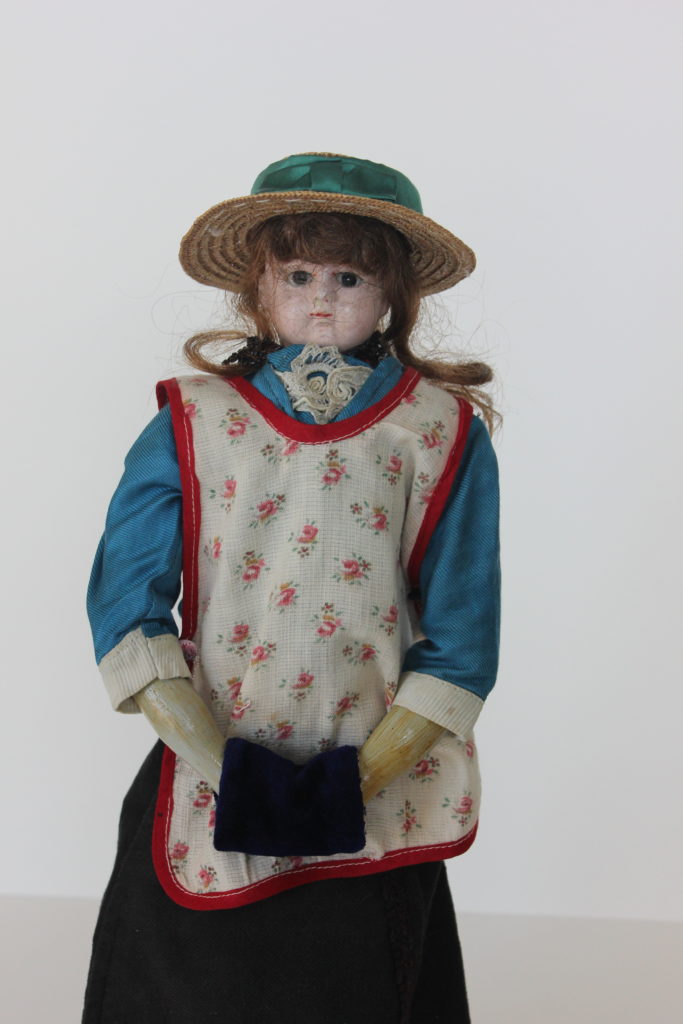 Doll with apron from Johannes Dyck's Collection